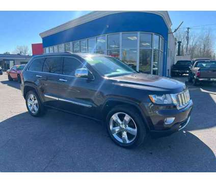 2012 Jeep Grand Cherokee for sale is a Brown 2012 Jeep grand cherokee Car for Sale in Ecorse MI