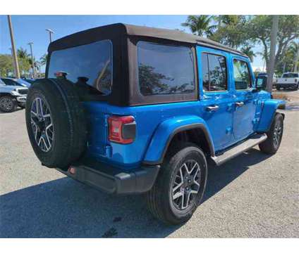 2024 Jeep Wrangler Sahara is a Blue 2024 Jeep Wrangler Sahara SUV in Naples FL