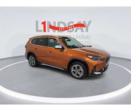 2023 BMW X1 xDrive28i is a Orange 2023 BMW X1 xDrive 28i SUV in Manassas VA