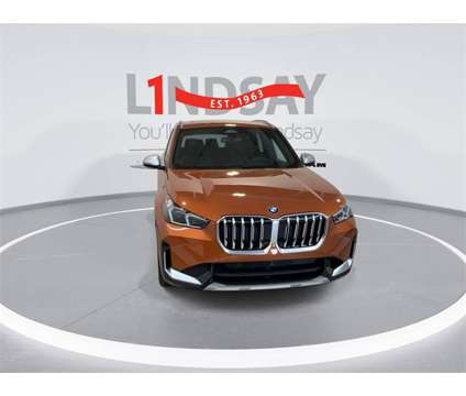 2023 BMW X1 xDrive28i is a Orange 2023 BMW X1 xDrive 28i SUV in Manassas VA