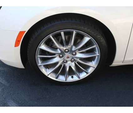 2014 Cadillac XTS Vsport Platinum is a White 2014 Cadillac XTS Vsport Platinum Sedan in Lansing MI