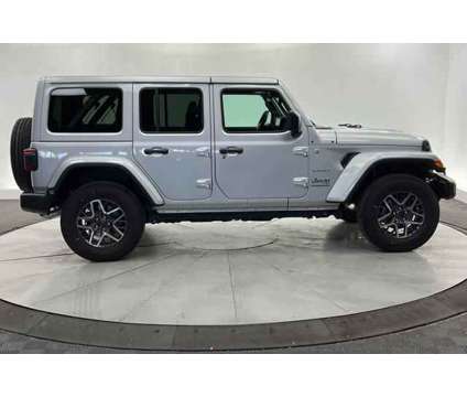 2024 Jeep Wrangler 4-Door Sahara 4x4 is a Silver 2024 Jeep Wrangler SUV in Saint George UT