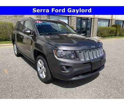 2016 Jeep Compass Latitude is a Grey 2016 Jeep Compass Car for Sale in Traverse City MI
