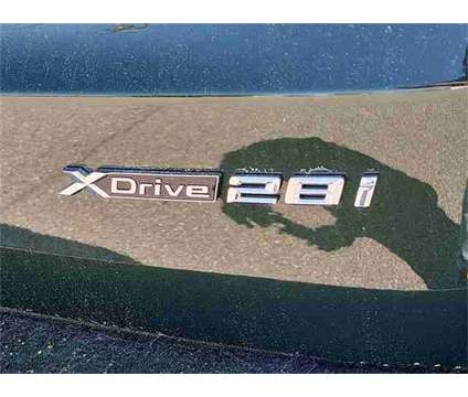 2024 BMW X1 xDrive28i is a Green 2024 BMW X1 xDrive 28i SUV in Milford DE