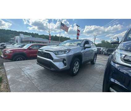 2021 Toyota RAV4 XLE is a Silver 2021 Toyota RAV4 XLE SUV in Akron OH