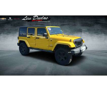 2011UsedJeepUsedWrangler UnlimitedUsed4WD 4dr is a Yellow 2011 Jeep Wrangler Unlimited Car for Sale in Stevens Point WI