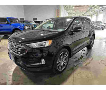 2021 Ford Edge Titanium is a Black 2021 Ford Edge Titanium SUV in Milwaukee WI