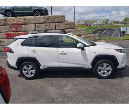 2021 Toyota RAV4 XLE Hybrid is a White 2021 Toyota RAV4 XLE Hybrid in Dubuque IA