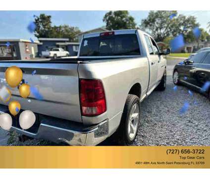 2011 Ram 1500 Quad Cab for sale is a Silver 2011 RAM 1500 Model Car for Sale in Saint Petersburg FL