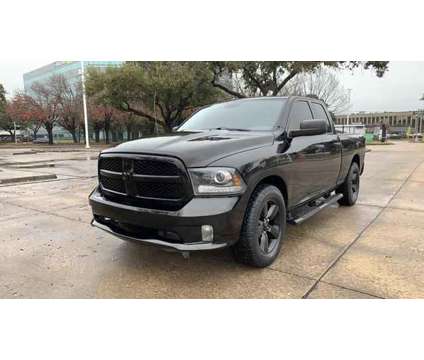 2014 Ram 1500 Quad Cab for sale is a Black 2014 RAM 1500 Model Car for Sale in Houston TX