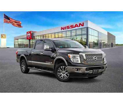 2018 Nissan Titan XD Platinum Reserve is a Black 2018 Nissan Titan XD Platinum Reserve Truck in Baytown TX