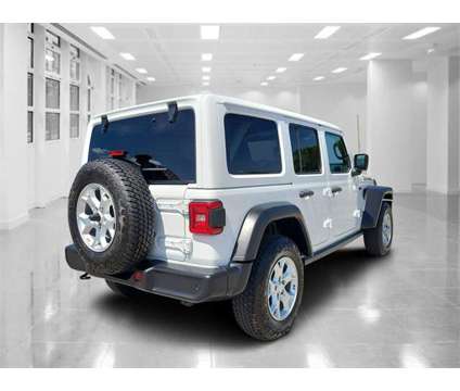 2021 Jeep Wrangler Unlimited Islander is a White 2021 Jeep Wrangler Unlimited Car for Sale in Orlando FL