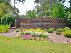 Must see sunny wooded lot in beautiful River Sea Plantation!