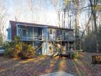 Nestled on a picturesque wooded site- 30068 HOLLYMOUNT RD