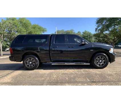 2011 Ram 1500 Quad Cab for sale is a Black 2011 RAM 1500 Model Car for Sale in Houston TX