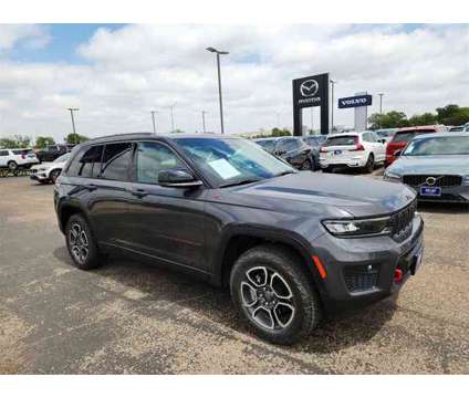 2022 Jeep Grand Cherokee Trailhawk is a Grey 2022 Jeep grand cherokee Trailhawk Car for Sale in Lubbock TX