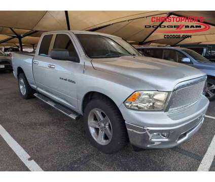 2012 Ram 1500 Big Horn Crew Cab Pickup is a Silver 2012 RAM 1500 Model Big Horn Car for Sale in Golden CO