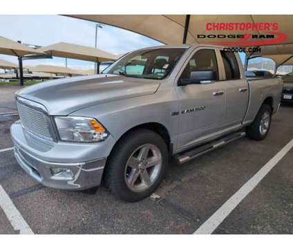 2012 Ram 1500 Big Horn Crew Cab Pickup is a Silver 2012 RAM 1500 Model Big Horn Car for Sale in Golden CO