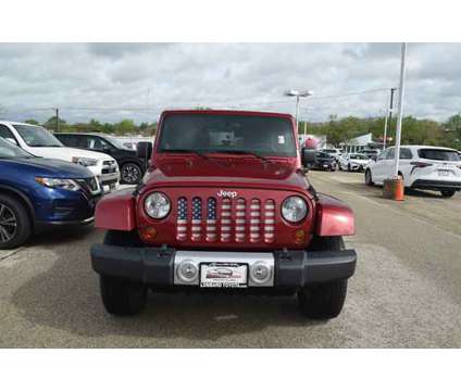 2012 Jeep Wrangler Unlimited Sahara is a Red 2012 Jeep Wrangler Unlimited Car for Sale in Lombard IL