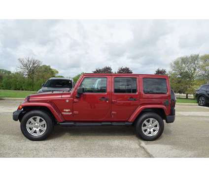 2012 Jeep Wrangler Unlimited Sahara is a Red 2012 Jeep Wrangler Unlimited Car for Sale in Lombard IL