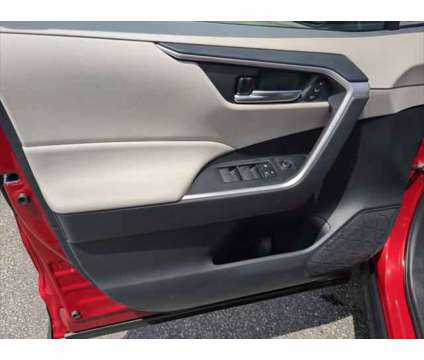 2021 Toyota RAV4 XLE Premium Hybrid is a Red 2021 Toyota RAV4 XLE Hybrid in Dubuque IA