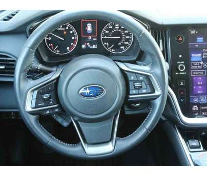 2021 Subaru Outback Premium is a White 2021 Subaru Outback 2.5i Station Wagon in Lansing MI