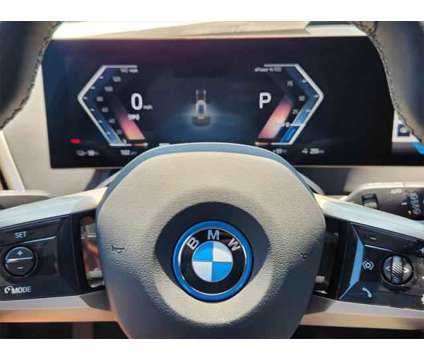 2025 BMW iX xDrive50 is a Grey 2025 BMW 325 Model iX SUV in Loveland CO