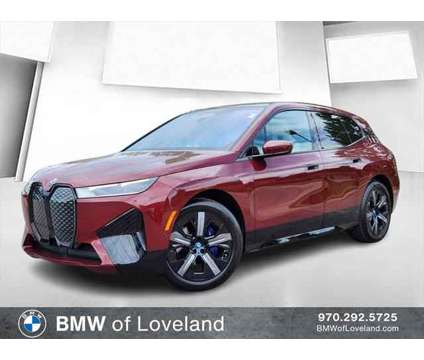 2025 BMW iX xDrive50 is a Red 2025 BMW 325 Model iX SUV in Loveland CO