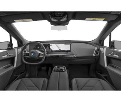 2025 BMW iX xDrive50 is a Red 2025 BMW 325 Model iX SUV in Loveland CO