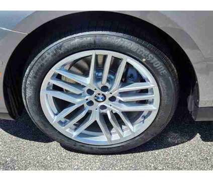 2024 BMW 5 Series i xDrive is a Grey 2024 BMW 5-Series Sedan in Loveland CO