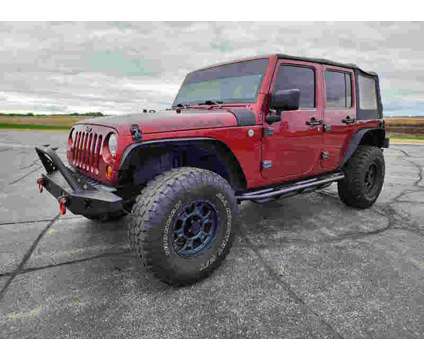 2012UsedJeepUsedWrangler UnlimitedUsed4WD 4dr is a Red 2012 Jeep Wrangler Unlimited Car for Sale in Watseka IL