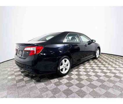 2014 Toyota Camry LE is a Silver 2014 Toyota Camry LE Car for Sale in Tampa FL