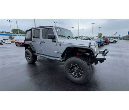 2016 Jeep Wrangler Unlimited Sahara is a Silver 2016 Jeep Wrangler Unlimited Sahara SUV in Newport News VA