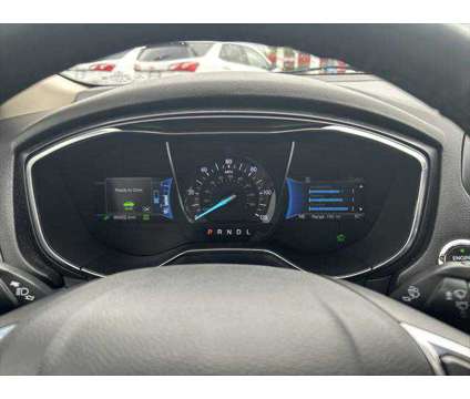 2018 Ford Fusion Hybrid Platinum is a Silver, White 2018 Ford Fusion Hybrid Platinum Hybrid in Dubuque IA
