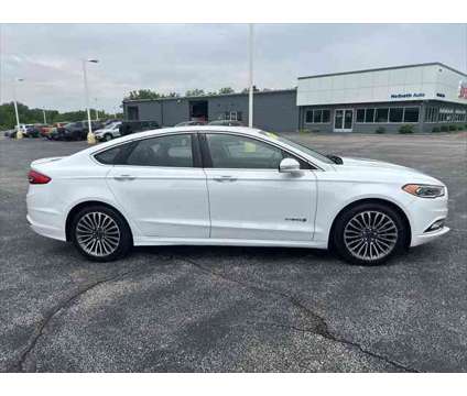 2018 Ford Fusion Hybrid Platinum is a Silver, White 2018 Ford Fusion Hybrid Platinum Hybrid in Dubuque IA