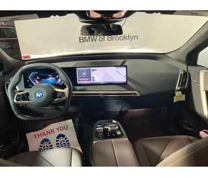 2025 BMW iX xDrive50 is a Grey 2025 BMW 325 Model iX SUV in Brooklyn NY