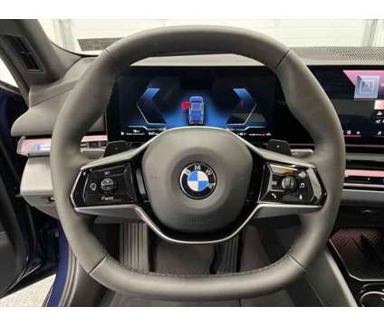 2024 BMW 5 Series i xDrive is a Blue 2024 BMW 5-Series Sedan in Erie PA