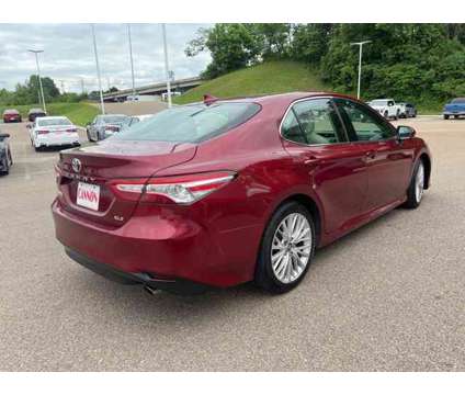 2019 Toyota Camry XLE is a Red 2019 Toyota Camry XLE Sedan in Vicksburg MS