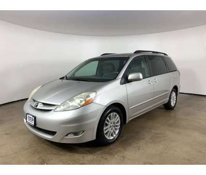 2010 Toyota Sienna XLE is a Silver 2010 Toyota Sienna XLE Car for Sale in Peoria IL