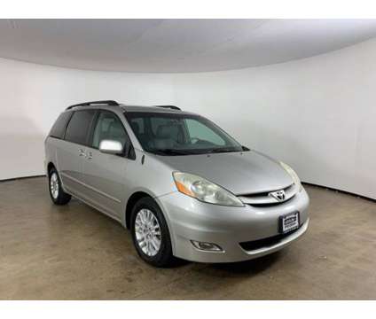 2010 Toyota Sienna XLE is a Silver 2010 Toyota Sienna XLE Car for Sale in Peoria IL