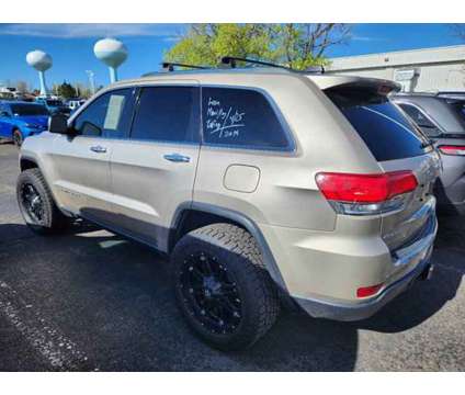 2014 Jeep Grand Cherokee Limited is a Tan 2014 Jeep grand cherokee Limited Car for Sale in Denver CO