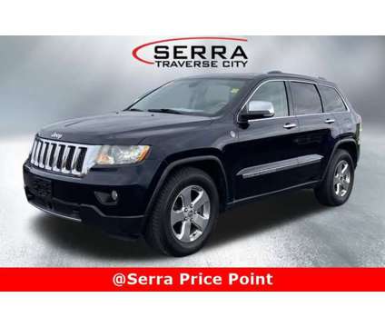 2011 Jeep Grand Cherokee Overland is a White 2011 Jeep grand cherokee Car for Sale in Traverse City MI