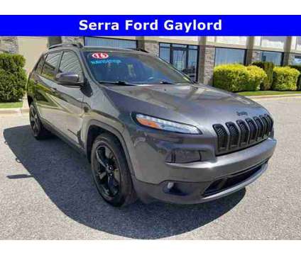 2016 Jeep Cherokee High Altitude is a Grey 2016 Jeep Cherokee Car for Sale in Traverse City MI