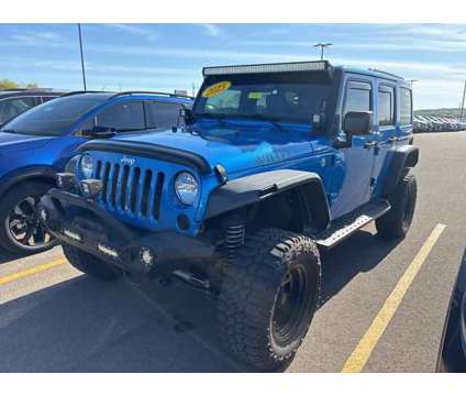 2015 Jeep Wrangler Unlimited Sahara is a Blue 2015 Jeep Wrangler Unlimited Sahara SUV in Chillicothe OH
