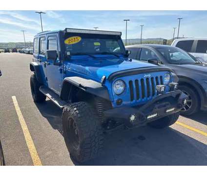 2015 Jeep Wrangler Unlimited Sahara is a Blue 2015 Jeep Wrangler Unlimited Sahara SUV in Chillicothe OH