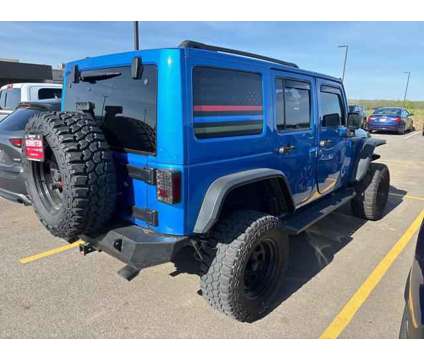 2015 Jeep Wrangler Unlimited Sahara is a Blue 2015 Jeep Wrangler Unlimited Sahara SUV in Chillicothe OH