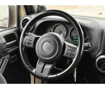 2012 Jeep Wrangler for sale is a Tan 2012 Jeep Wrangler Car for Sale in Lincoln NE