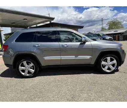 2013 Jeep Grand Cherokee for sale is a Silver 2013 Jeep grand cherokee Car for Sale in Wheat Ridge CO