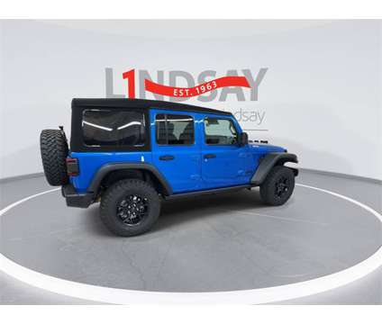 2024 Jeep Wrangler Willys Wheeler is a Blue 2024 Jeep Wrangler SUV in Manassas VA