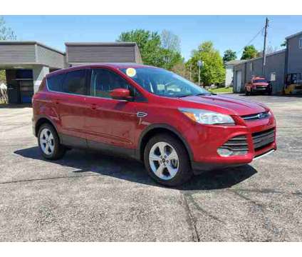 2016 Ford Escape SE is a Red 2016 Ford Escape SE Car for Sale in Paw Paw MI